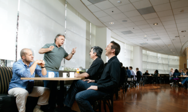 Jobs' inner circle includes (from left) Jonathan Ive, Phil Schiller, Eddy Cue, and Scott Forstall, photographed on the Apple Campus in 2010.