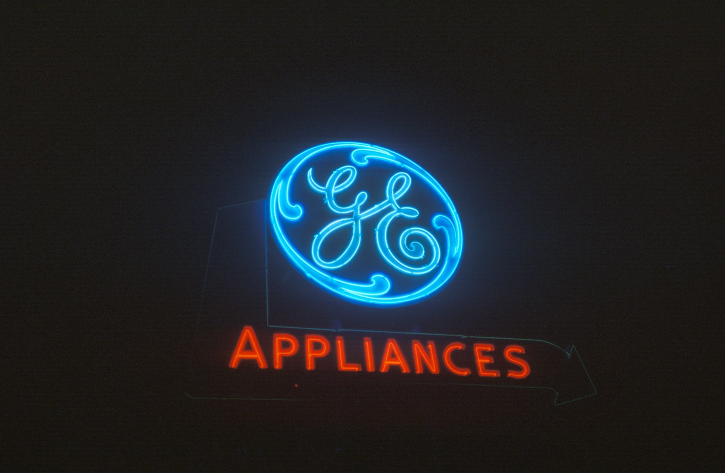 A neon sign that reads "GE Appliances"
