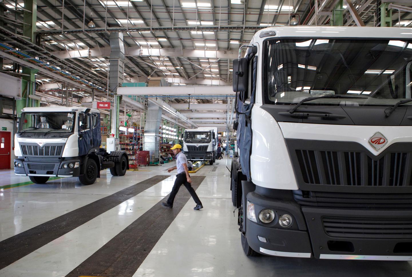 Mahindra Navistar trucks on an assembly line in Maharashtra, India. 