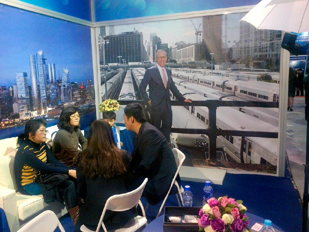 Related's booth at the Invest in America Summit EB-5trade fair in Shanghai, China. The portrait of Stephen Ross was originally commissioned for Fortune's story on their Hudson Yards  project. 