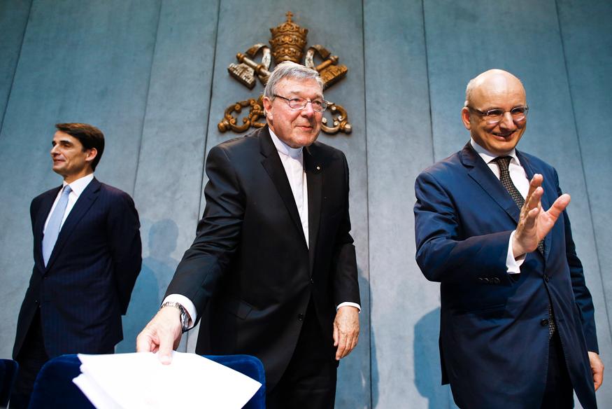 Jean-Baptise de Franssu (L), new president of Vatican Bank IOR, outgoing President Ernst Von Freyberg (R) and Cardinal George Pell at a news conference at the Vatican July 9, 2014.