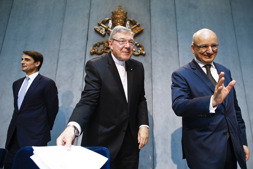 Jean-Baptise de Franssu (L), new president of Vatican Bank IOR, outgoing President Ernst Von Freyberg (R) and Cardinal George Pell at a news conference at the Vatican July 9, 2014.