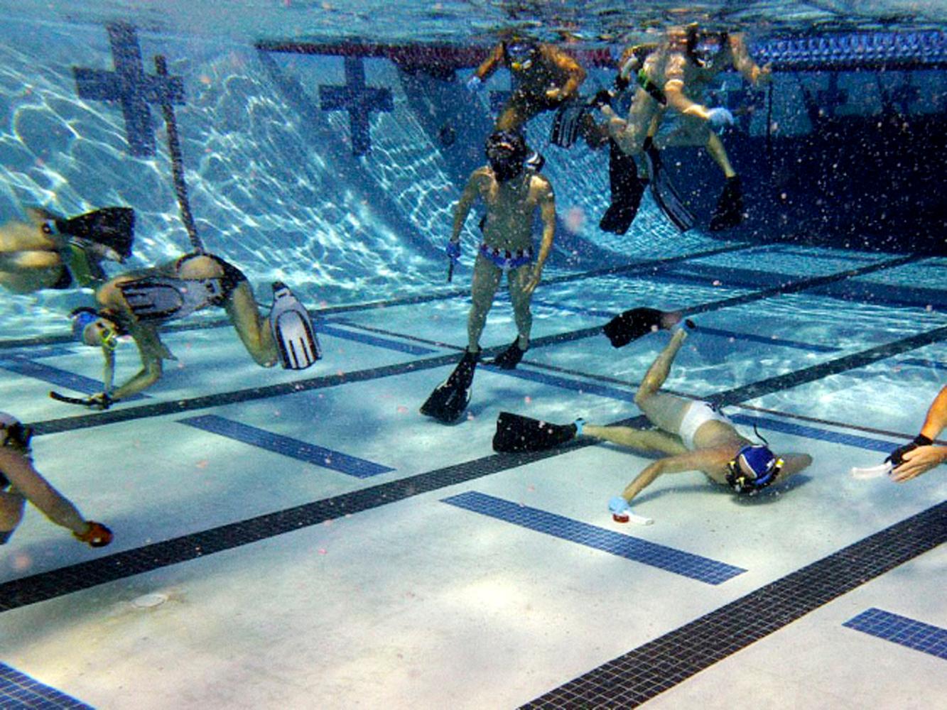Lyndon Rive playing underwater hockey