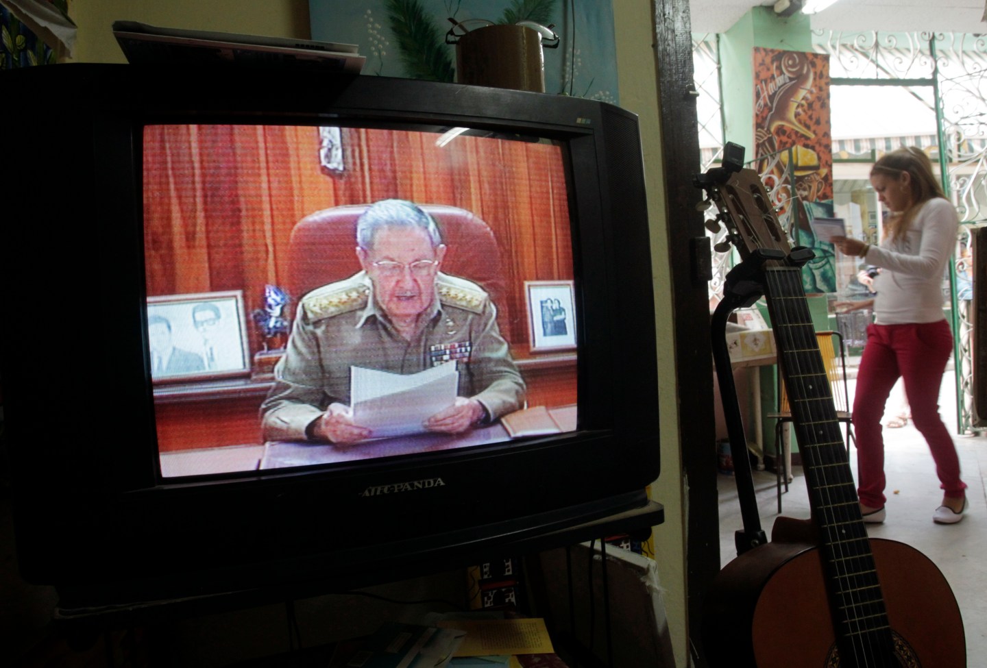 A television shows Cuba's President Raul Castro speaking during a television broadcast in Havana