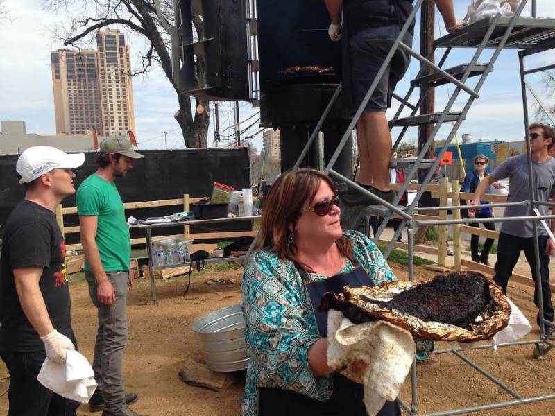 GE "pit chemist" Lynn DeRose serves up some brisket.