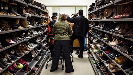 Black Friday shoppers line up at a layaway counter at a TJ Maxx store in Alexandria, Virginia