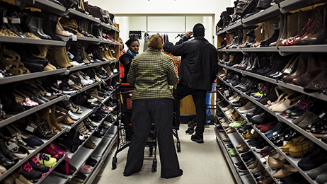 Black Friday shoppers line up at a layaway counter at a TJ Maxx store in Alexandria, Virginia