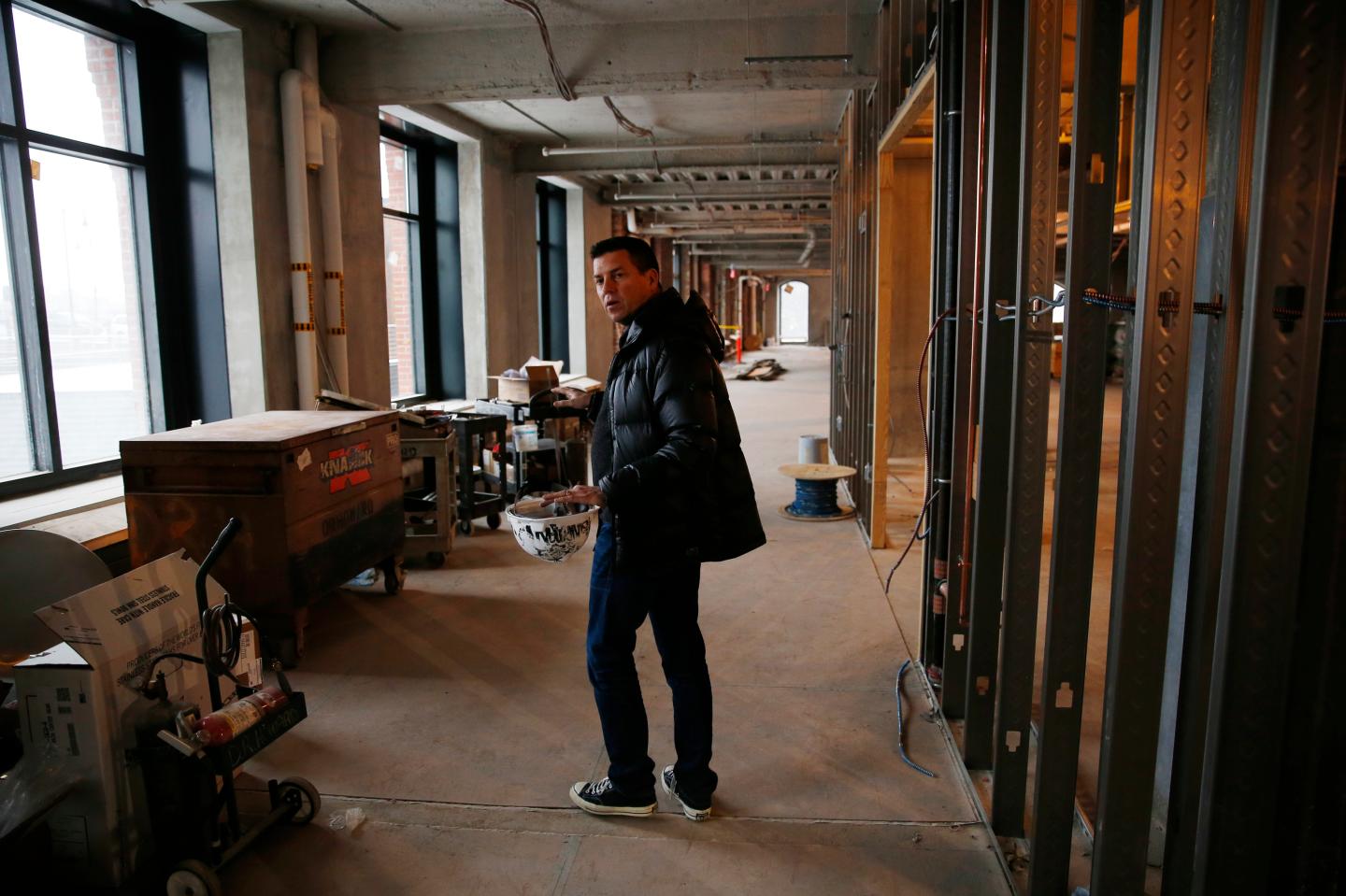 Converse CEO Jim Calhoun takes the Globe on a tour of Converse Inc.'s new headquarters in Boston, Massachusetts January 15, 2015.