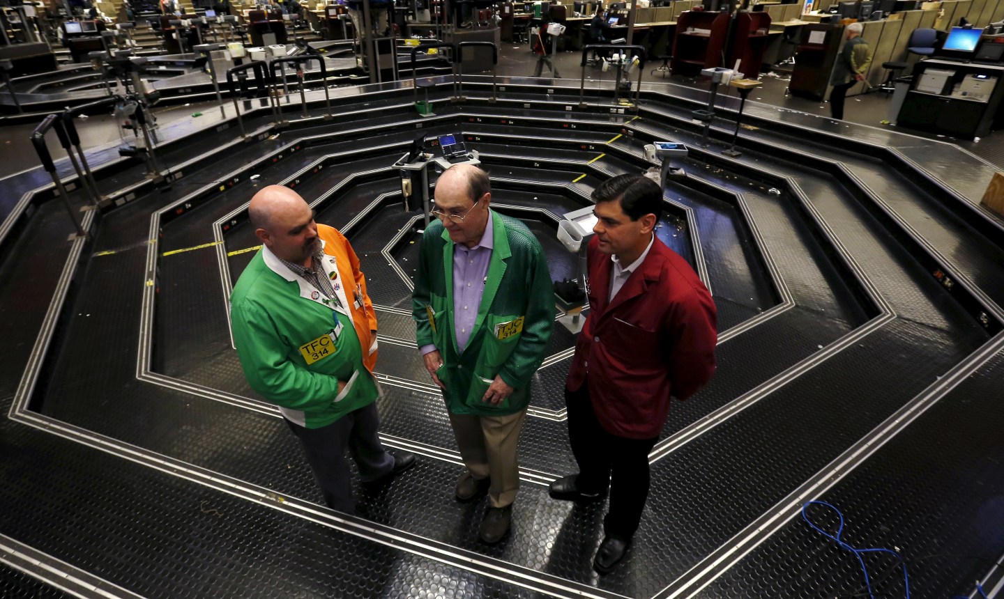 Thomas J. Cashman is joined by his two sons Thomas F. Cashman and Brendon Eugene Cashman on the Chicago Board of Trade grain trading floor in Chicago