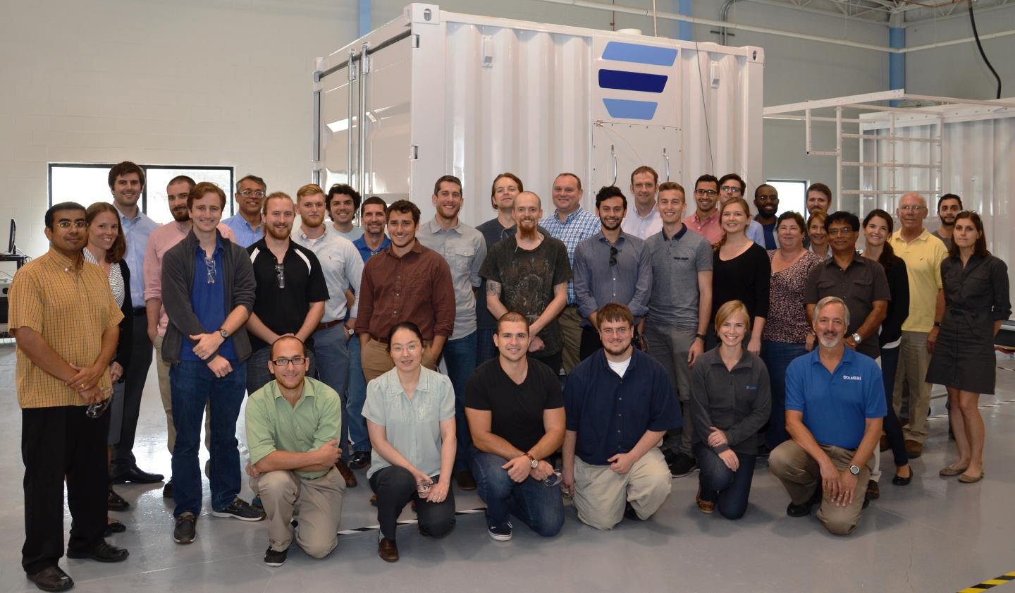 Ambri's current team standing in front of its liquid metal battery.