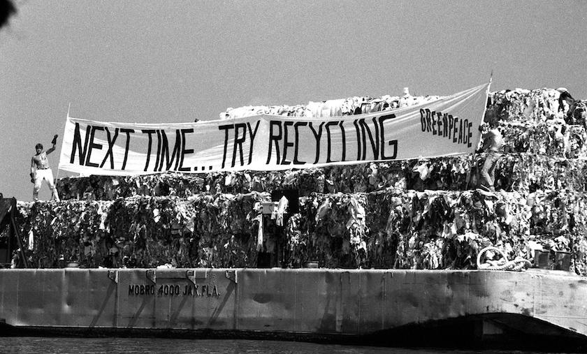 Members of the environmental group Greenpeace display banner