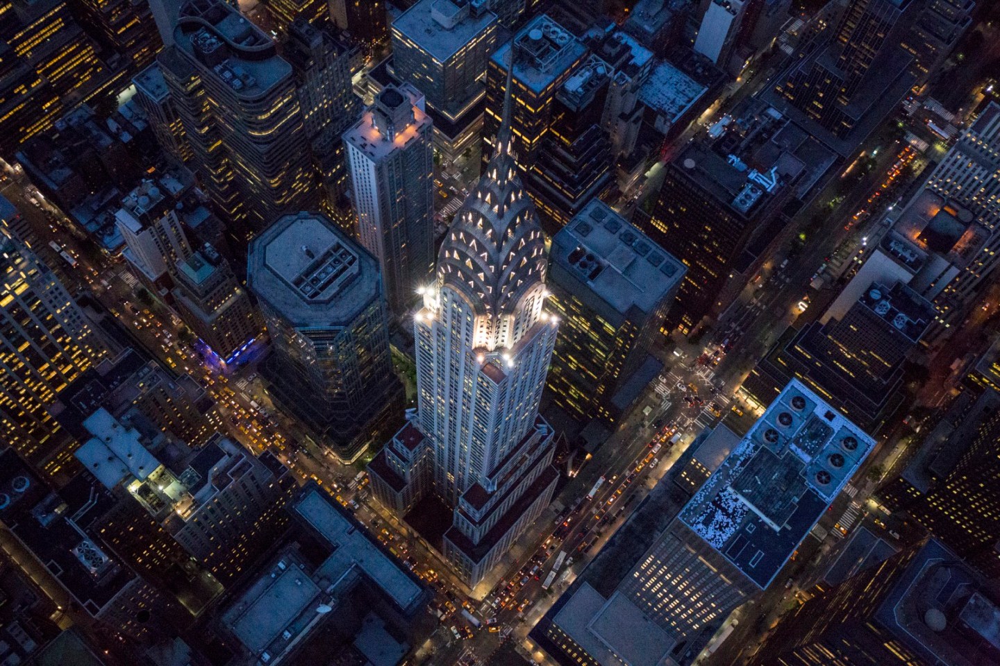 The design is fabricated from chrome-nickel steel and symbolizes the twentieth century. The Chrysler Building had sheet-metal shops on the 65th and 67th floors, and the design motif is points radiating out from a rounded base, a sunburst to greet the world. William Van Alen’s seventy-seven story Chrysler Building was the world’s tallest for only eleven months, until the Empire State Building surpassed it in 1931, but no skyscraper has ever surpassed its harmonious design, the grace with which its crown emerges from its shaft, the seamless transition from brick to steel. The Chrysler Building owes its existence to Walter P. Chrysler, who backed Van Alen’s dazzling plan with his own cash after the original developer got cold feet. An industry study in 1929, just before the Crash, argued that construction costs rendered Midtown buildings above sixty-three stories unprofitable ventures, and the top seven floors of the Chrysler Building are barely rentable thanks to that gorgeous crown. Chrysler was paying for immortality, but he made Van Alen sue for his fee.