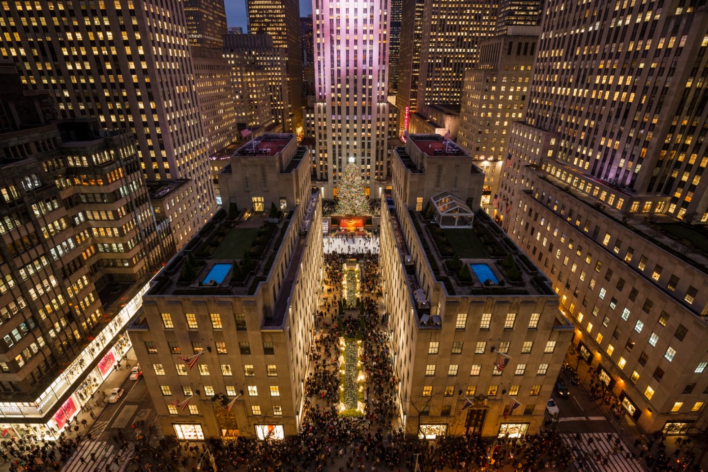 Heres the heart of Rockefeller Center, the Art Deco complex that John D. Rockefeller, Jr., spent the entire decade of the 1930s building with his architect, Raymond Hood. We are looking directly down on the Channel Gardens, which lead pedestrians from Fifth Avenue, left, to the plaza in front of the GE Building (aka 30 Rock), which was being used by a café when this photograph was taken in May, but becomes a skating rink in winter. The small platform with scaffolding, right, where the Christmas tree stands tall in December, is being readied for the installation of a sculpture by Jeff Koons. Some of the buildings have exquisite rooftop gardens kept mostly for the pleasure of people who work in the complex.