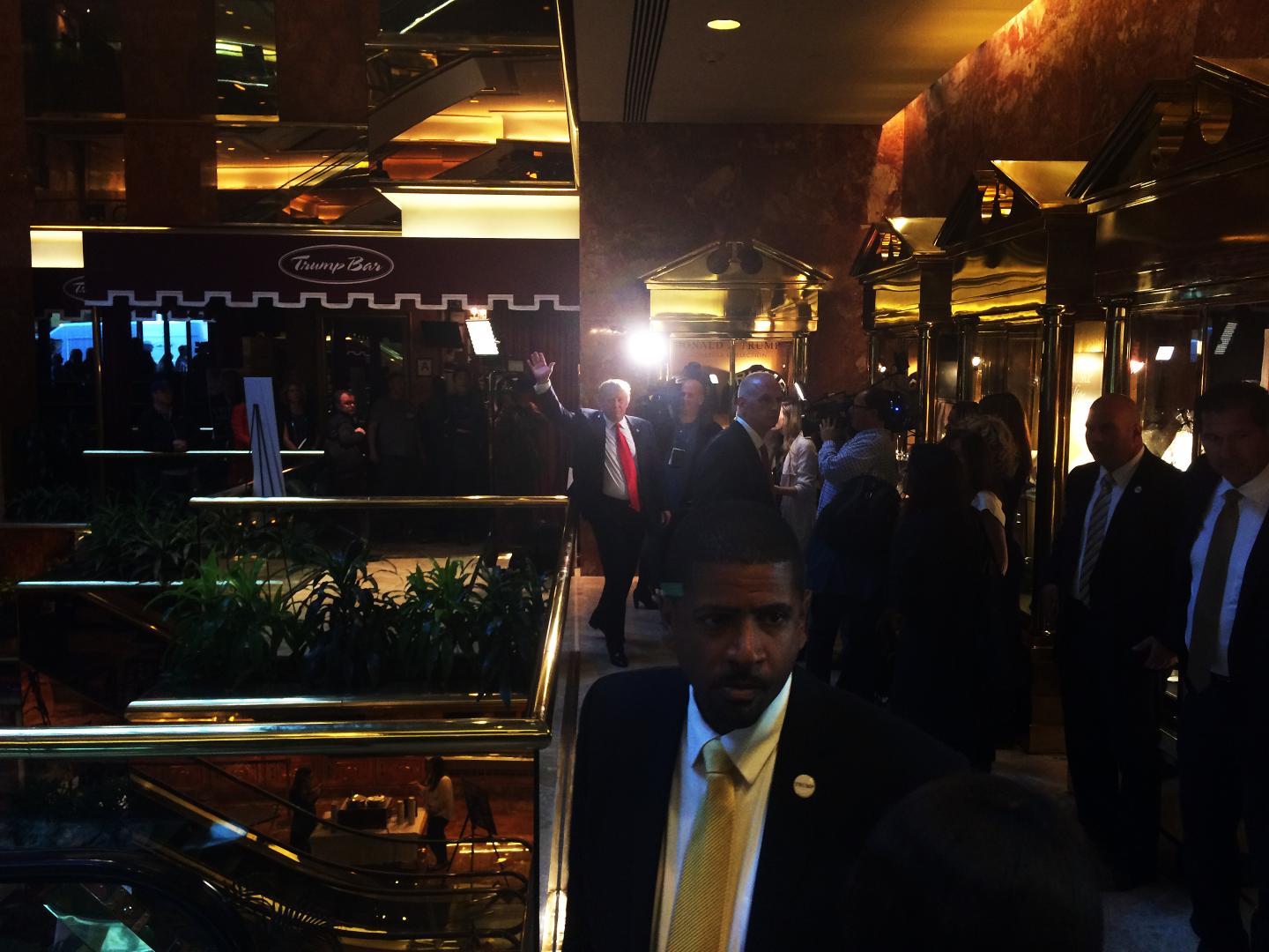Donald Trump waves and walks to his book signing table to launch his new book 'Crippled America: How to Make America Great Again' at Trump Tower on November 3, 2015 in New York.