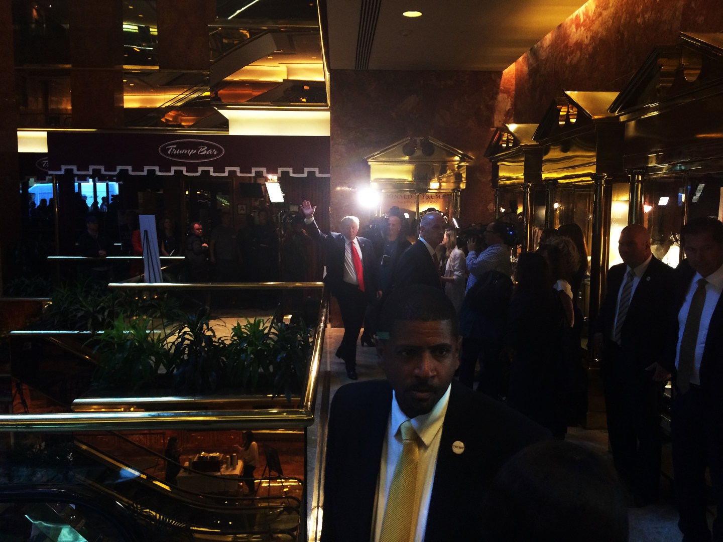 Donald Trump waves and walks to his book signing table to launch his new book 'Crippled America: How to Make America Great Again' at Trump Tower on November 3, 2015 in New York.