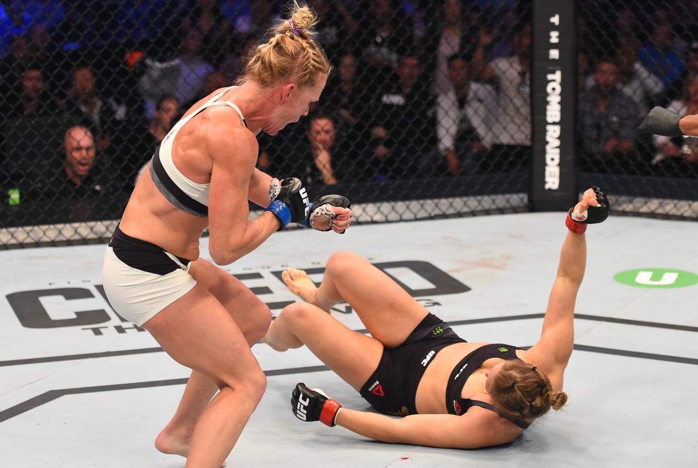 (L-R) Holly Holm of the United States follows up after knocking down Ronda Rousey of the United States with a kick in their UFC women's bantamweight championship bout during the UFC 193 event at Etihad Stadium on November 15, 2015 in Melbourne, Australia. 