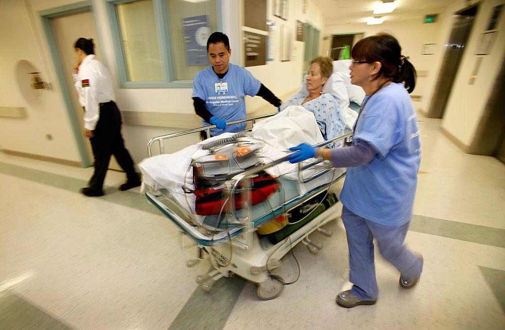 Patient Karen Ballog, 57yearsold is moved from her room in the cardiac care unit through the hall