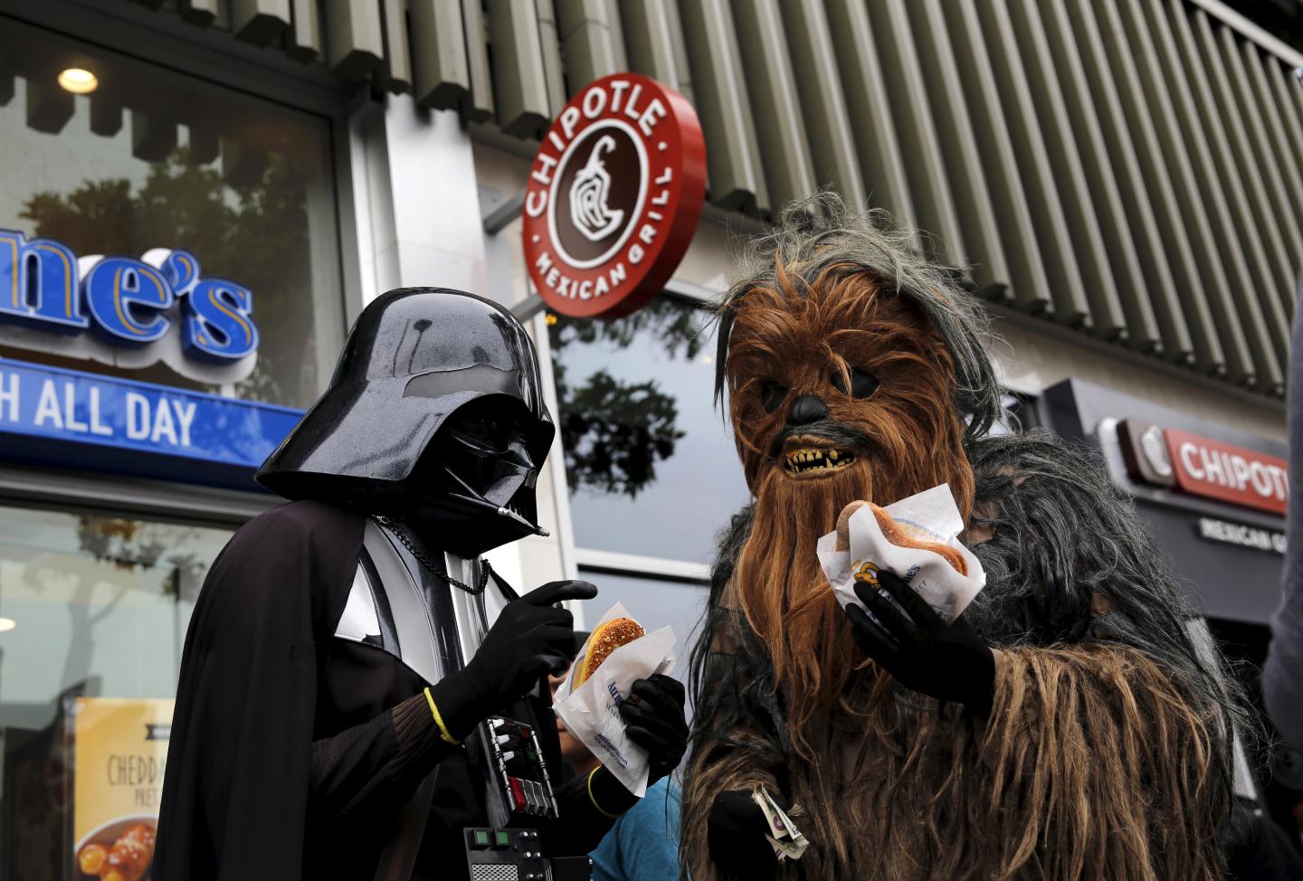 People wearing Star Wars-themed costumes eat pretzels in San Francisco, California