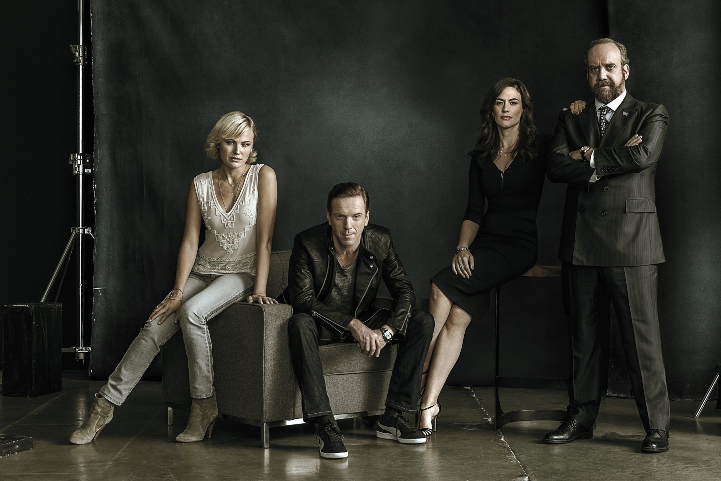 Showtime original series Billions. - Photo: James Minchin/SHOWTIME - Photo ID: BILLIONS_PRArt_02.R Pictured: Malin Akerman as Lara Axelrod, Damian Lewis as Bobby "Axe" Axelrod, Maggie Siff as Wendy Rhoades and Paul Giamatti as Chuck Rhoades