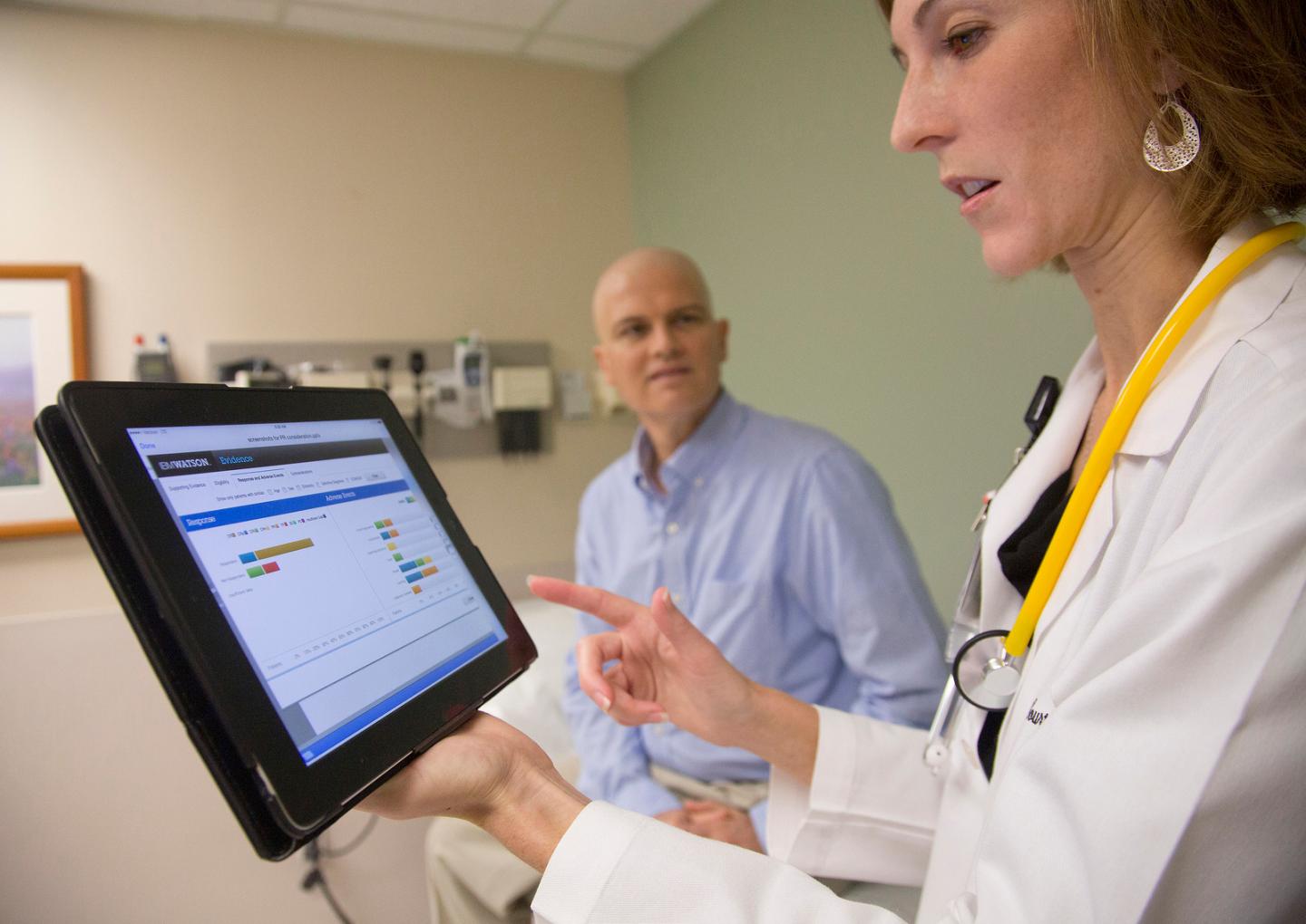 At the University of Texas MD Anderson Cancer Center, Assistant Professor of Leukemia Dr. Courtney DiNardo uses IBM's Watson cognitive system while consulting with patient Rich Ware.