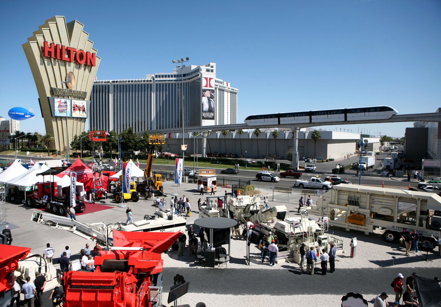 Terex Corp. construction equipment, foreground, sits on disp