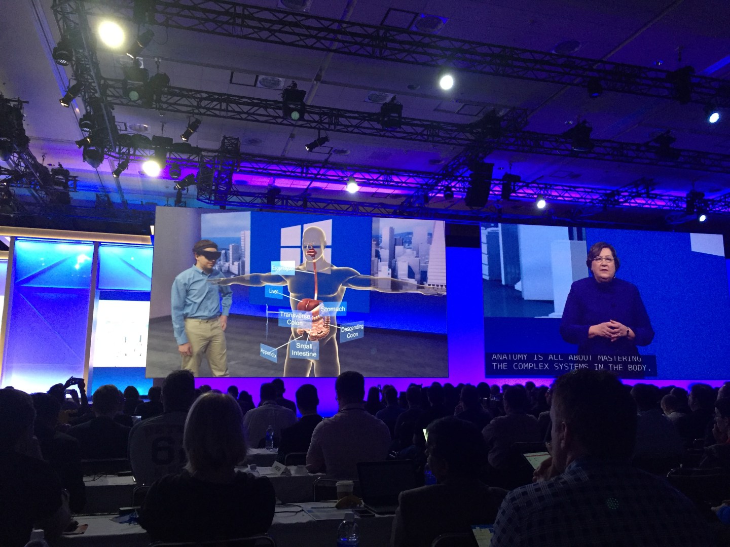 Students show off the HoloLens device at Microsoft's developer conference.