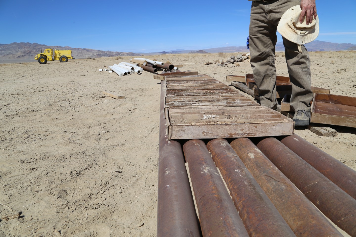 Samples of the earth's core in Clayton Valley, Nevada lie in boxes, temporarily propped up on metal piping.