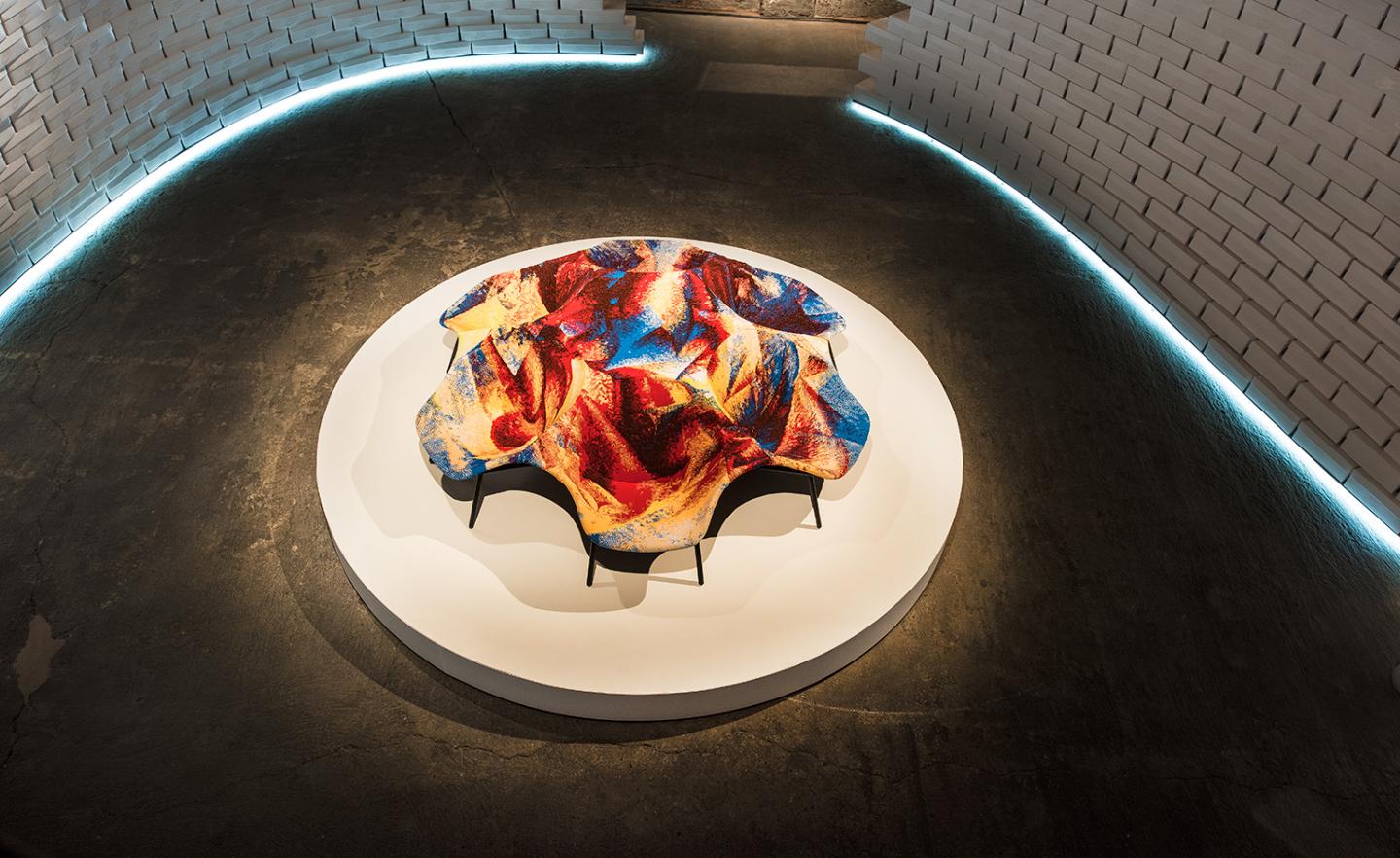 Sebastian Wrong's commission—an ergonomic chair formation which is intended as communal seating, and wraps the intricate Flyknit textile around a hollowed steel frame.