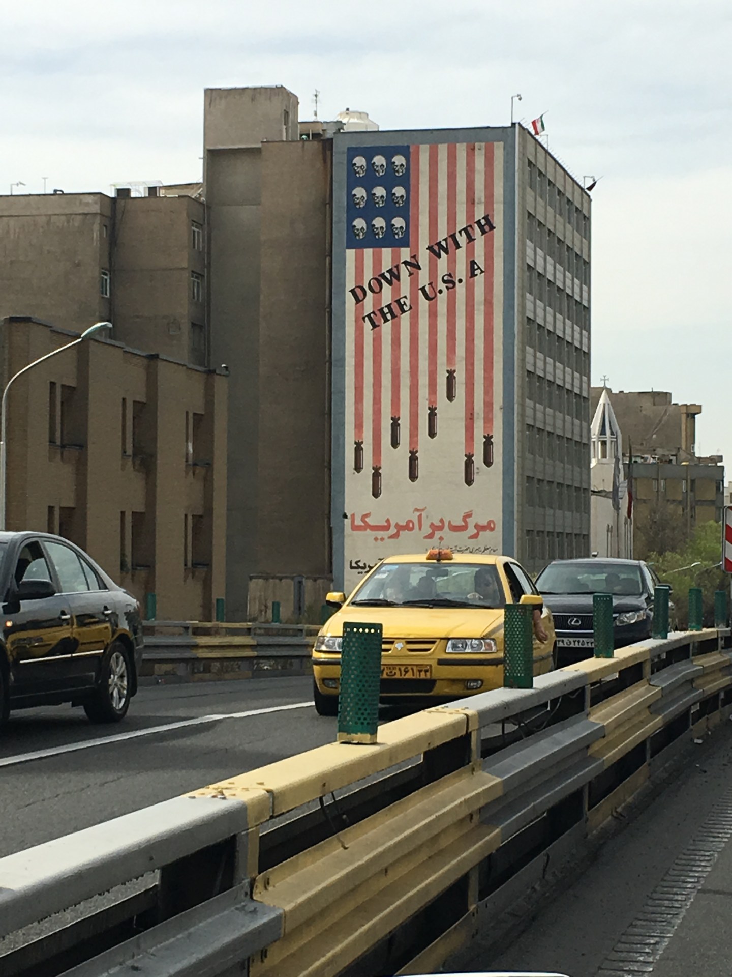 A revolutionary mural in Tehran shows bombs and skulls on the US flag, with the words, "We will not compromise with America, even for one second." The decades-old mural has remained, despite Iran's nuclear deal with the West.