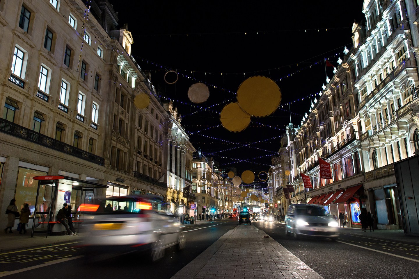 LONDON, ENGLAND - DECEMBER 08: Regent Street displays a series of golden sequins, cogs and coils as part of it's Christmas light display on December 8, 2015 in London, England. British retailers are hoping for a rise in sales over the Christmas period after November's Black Friday sales failed to boost turnover. (Photo by Ben Pruchnie/Getty Images)