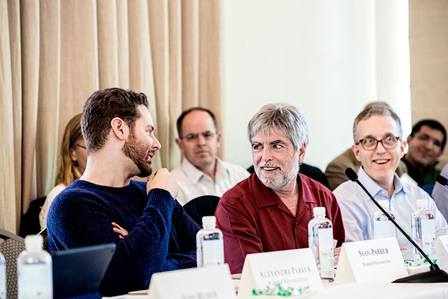 Tech Entrepeneur Sean Parker (left) talks to Jeff Bluestone (center), CEO and president of the Parker Institute for Cancer Immunotherapy, during a retreatat the Meadowood resort in St. Helena, CA.Photo by Winni Wintermeyer for Fortune. April 4, 2016.
