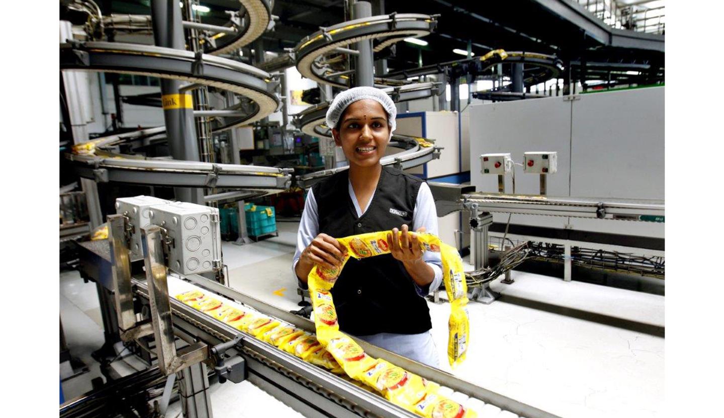 Maggi Noodles come off the manufacturing line after the ban lifted in one of Nestle's 5 Indian factories. 
