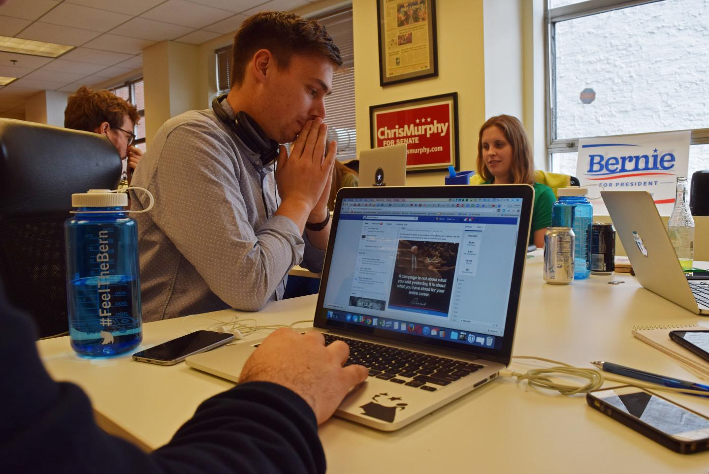 Hector Sigala works on a Facebook post for the Bernie Sanders campaign in Washington