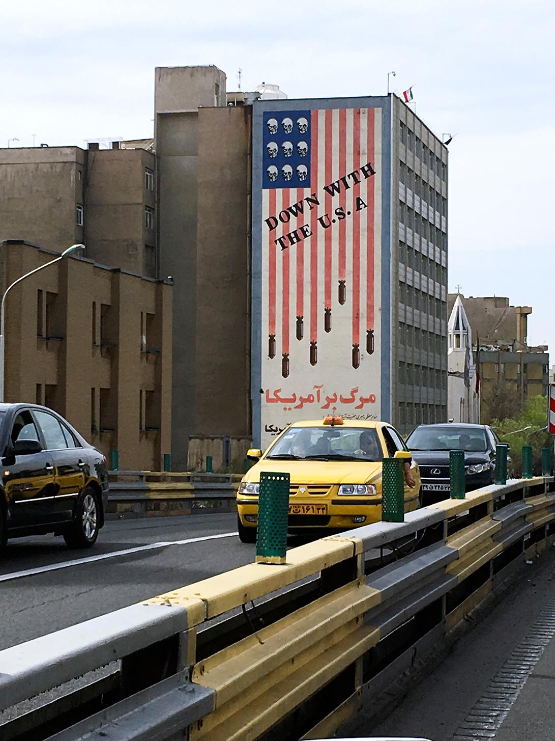 A revolutionary mural in Tehran shows bombs and skulls on the US flag, with the words, "We will not compromise with America, even for one second." The decades-old mural has remained, despite Iran's nuclear deal with the West.