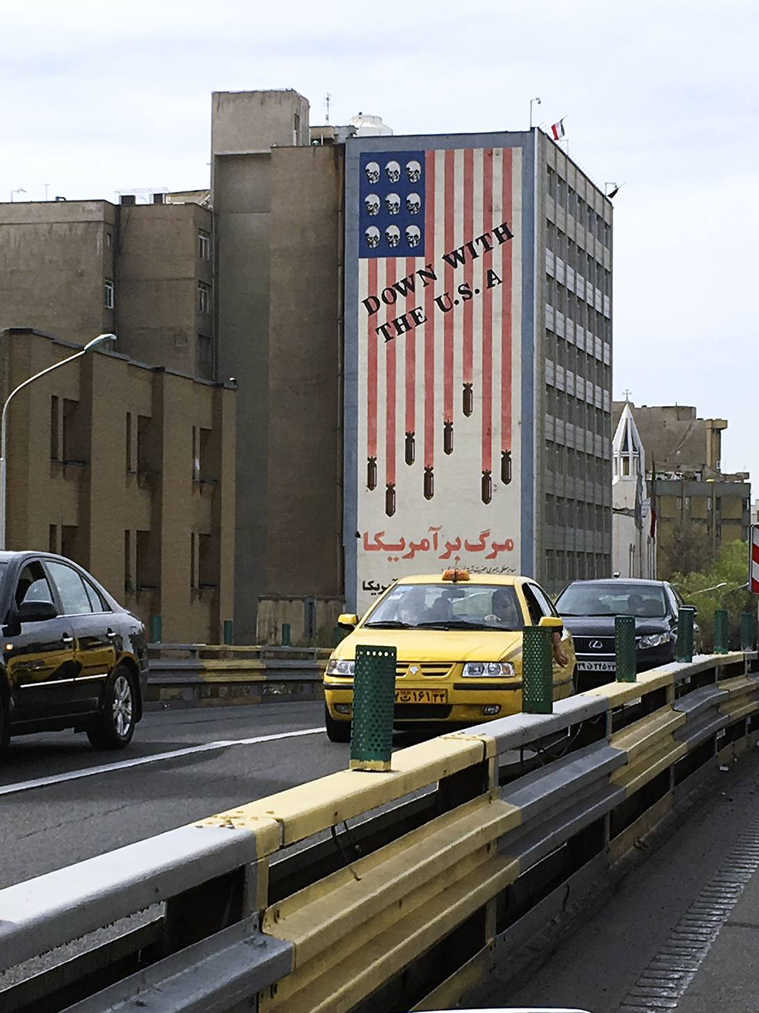 A revolutionary mural in Tehran shows bombs and skulls on the US flag, with the words, "We will not compromise with America, even for one second." The decades-old mural has remained, despite Iran's nuclear deal with the West.