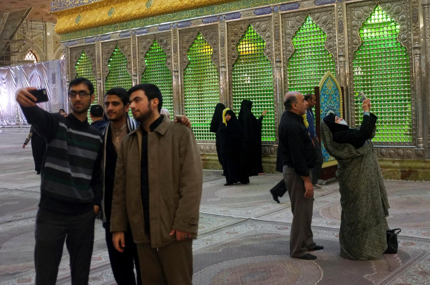 Visitors to the Ayatolah Khomeini's shrine in Tehran take selfies. 