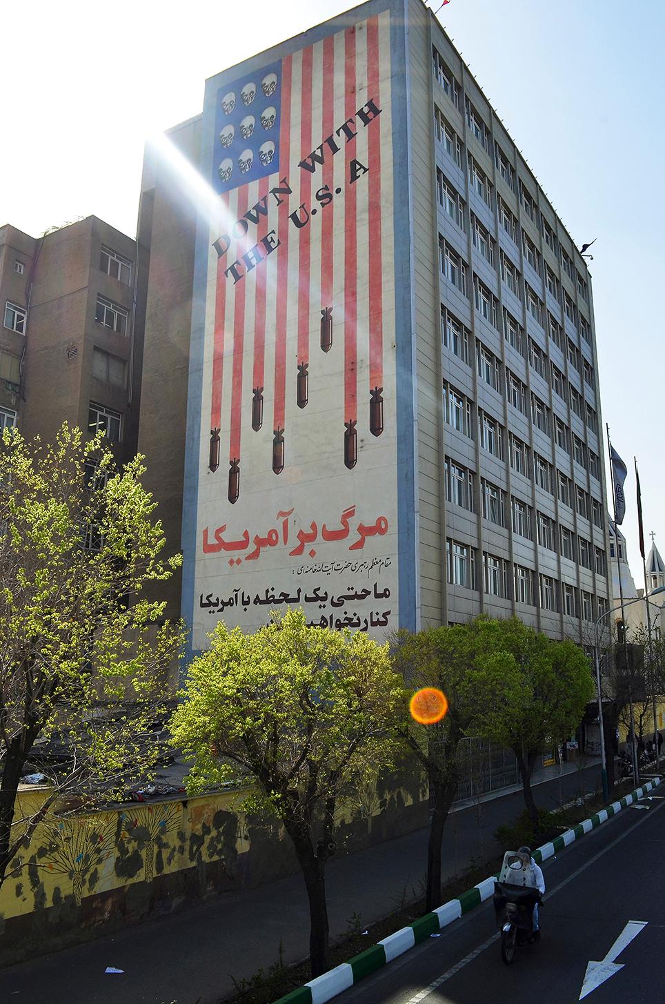 Symbols of antipathy to the U.S. coexist with signs of a yearning for a Western lifestyle. The Persian text read "Iran will not deal with America even for a second" 