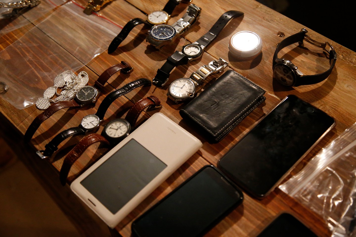 Soldiers' booty, after confiscating valuables from participants at the border crossing in A Day in the Life of a Refugee.