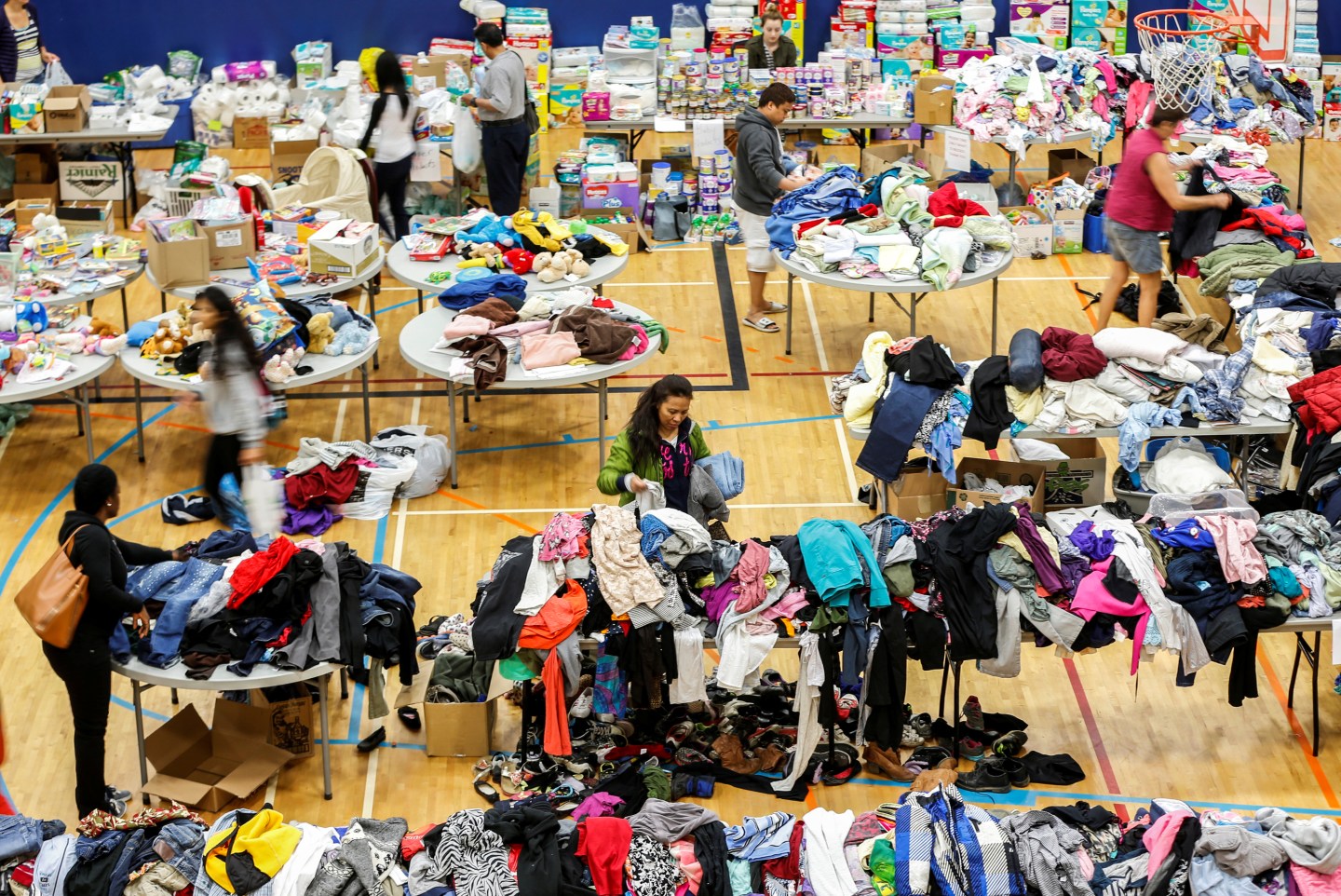 Evacuees from the Fort McMurray wildfires look through donated goods and clothing at the "Bold Center" in Lac la Biche