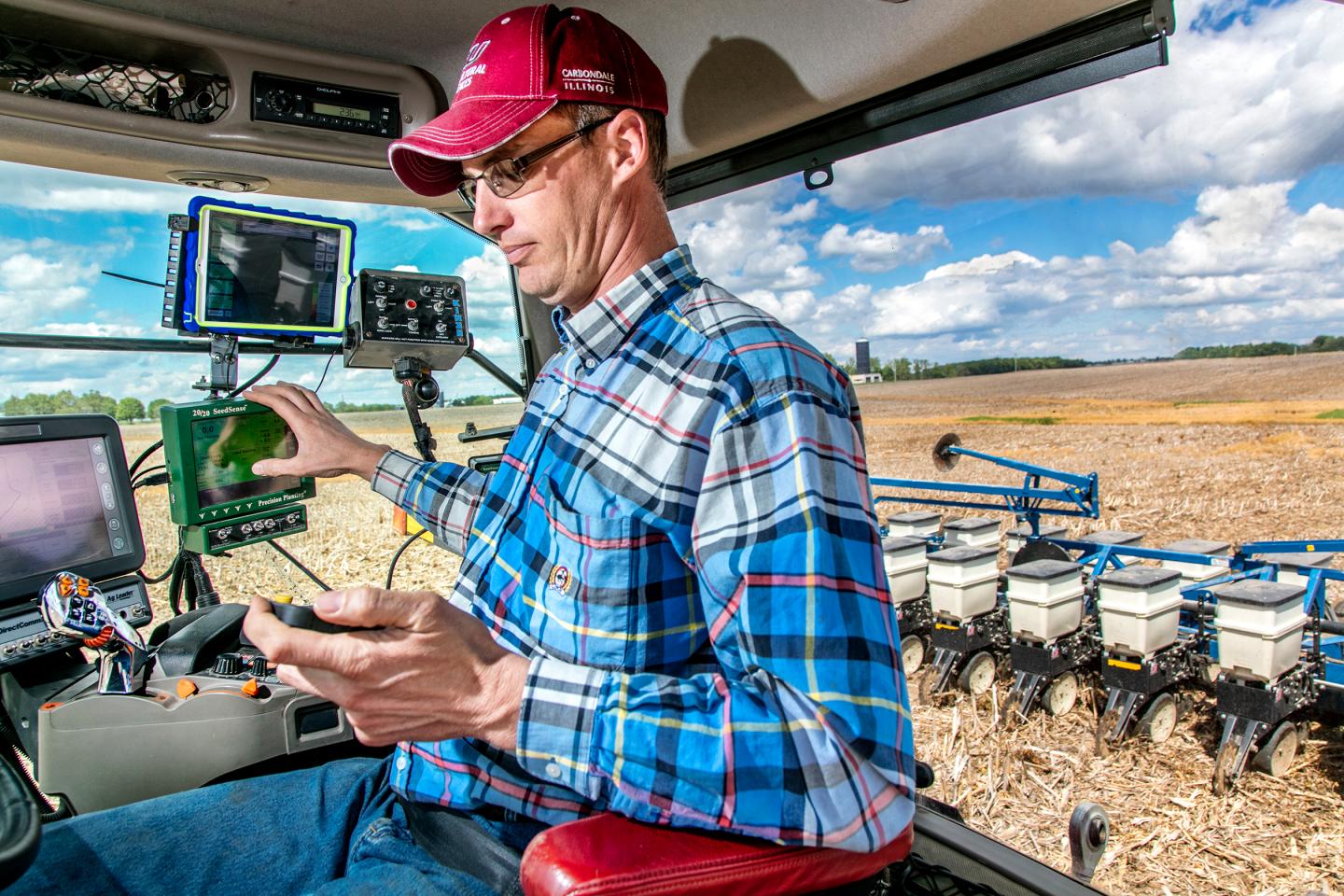 Farmer Jeff Heepke, manages the tractor and associated technology while running the planter at his family's farm in Edwardsville, Ill., on Wednesday, May 4, 2016. Photo by Ryan Donnell.