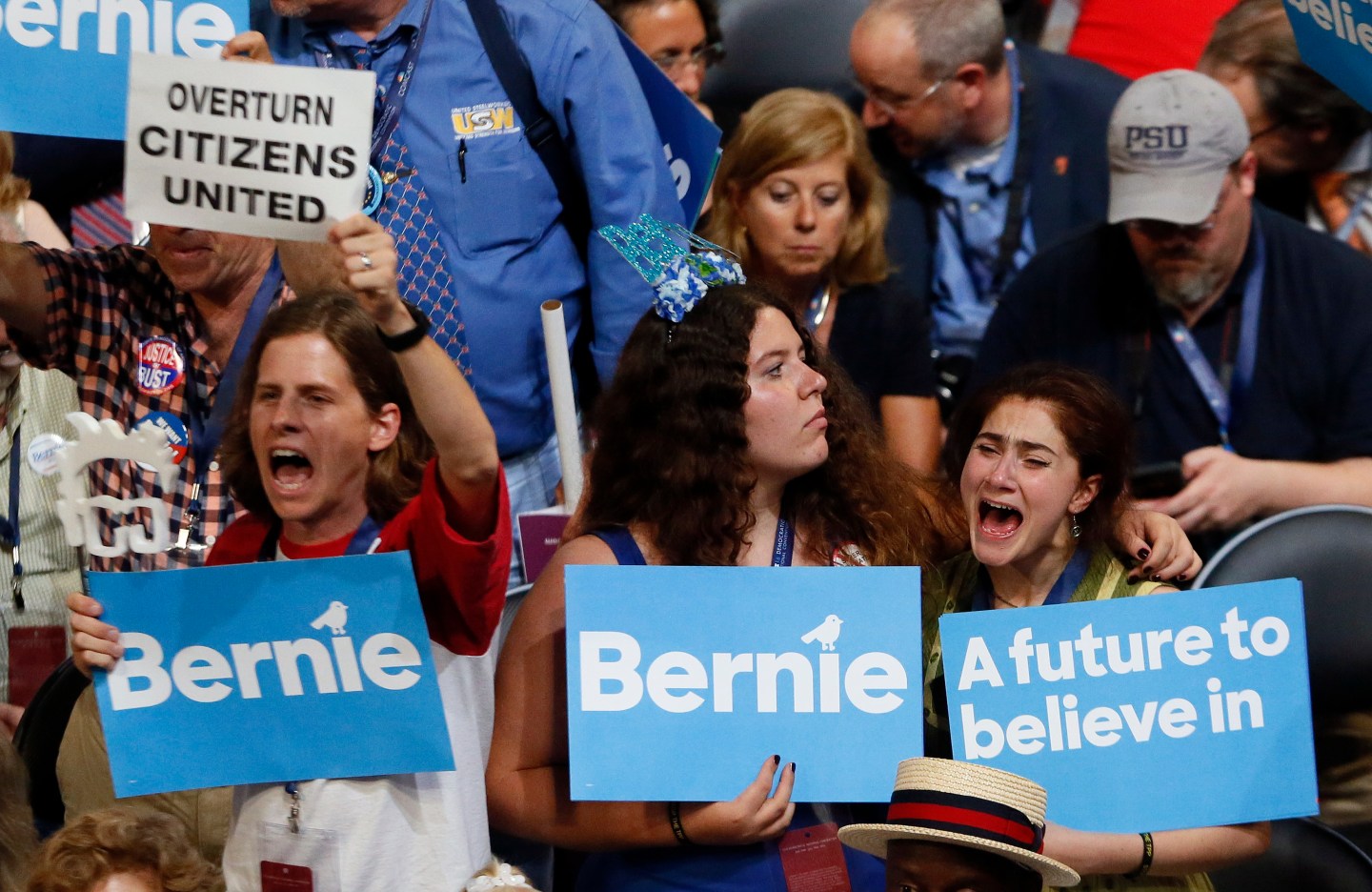 Bernie Sanders react as they listen to him speak during the Democratic National Convention in Philadelphia