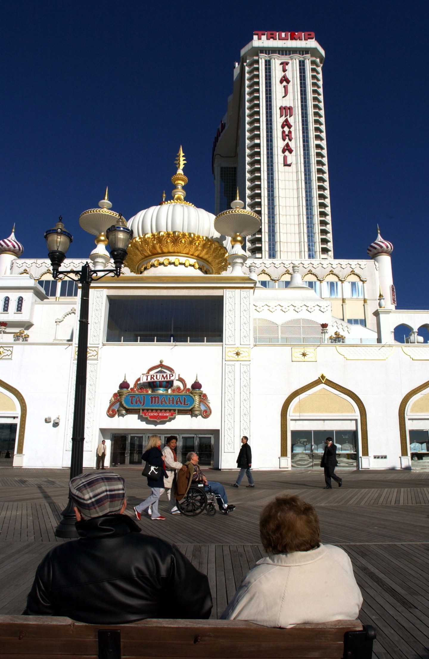People pass the boardwalk entrance to the Trump taj mahal ca