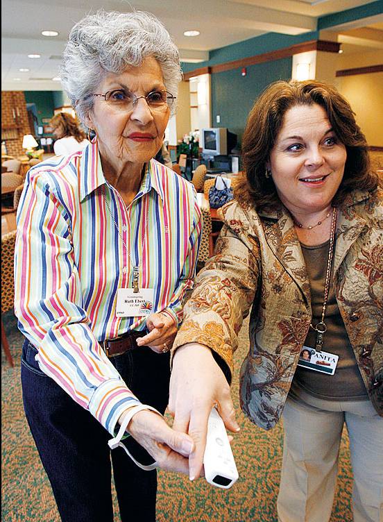 Resident of the Greenspring Village Community in Springfield, Virginia, plays video game on Wii game console