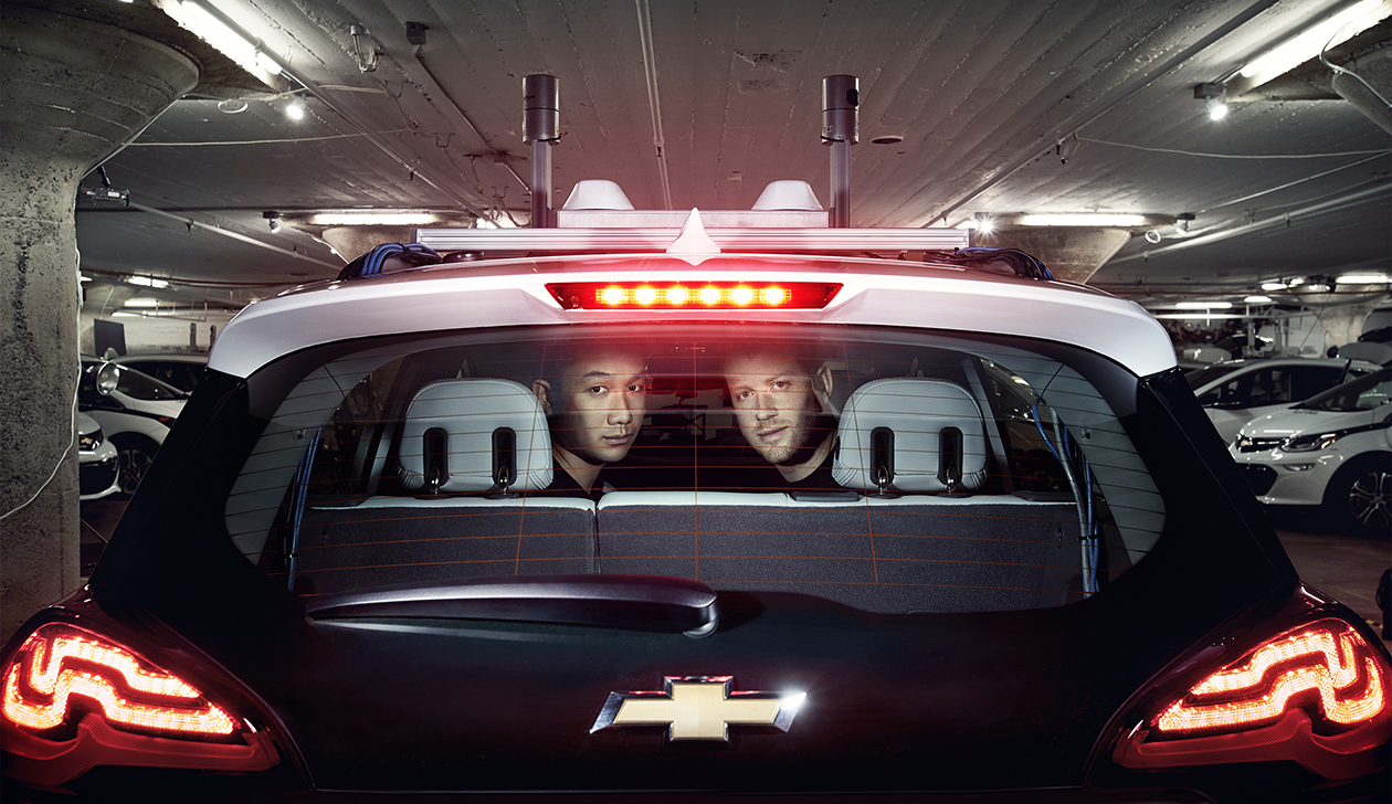 Cruise COO Daniel Kan (left) and CEO Kyle Vogt (right) in a Chevrolet self-driving-car prototype with a laser sensor on its roof.