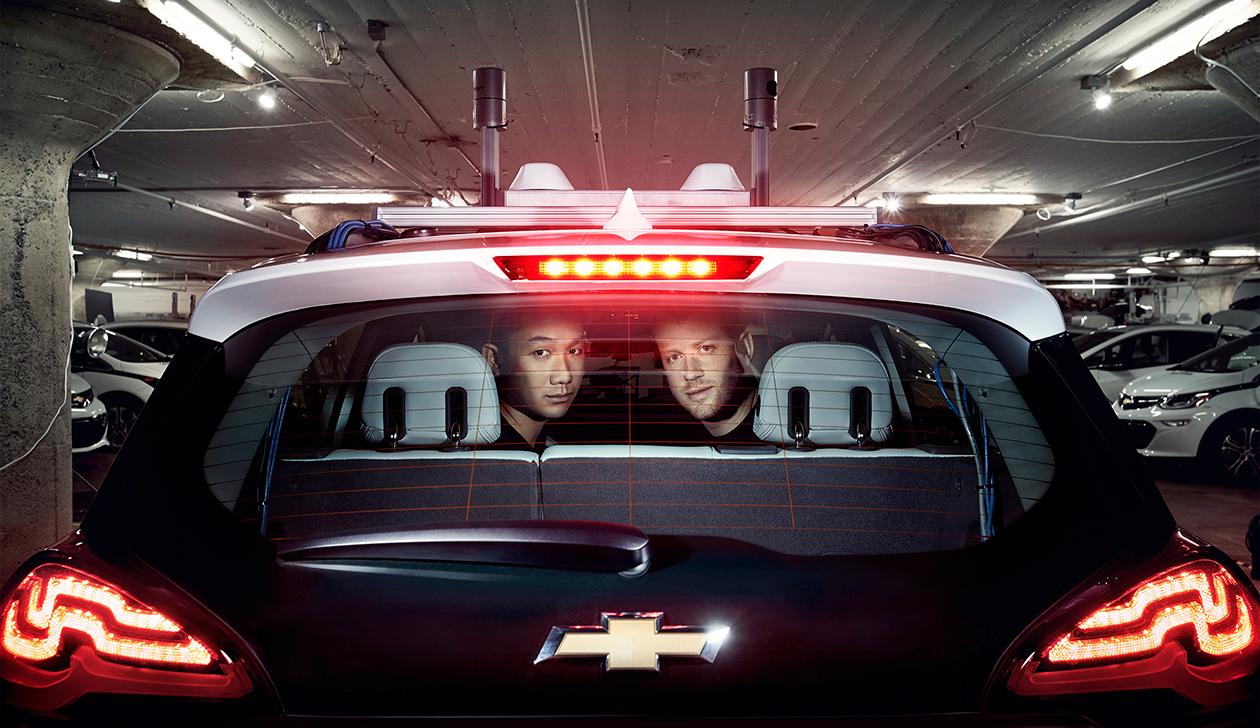 Cruise COO Daniel Kan (left) and CEO Kyle Vogt (right) in a Chevrolet self-driving-car prototype with a laser sensor on its roof.