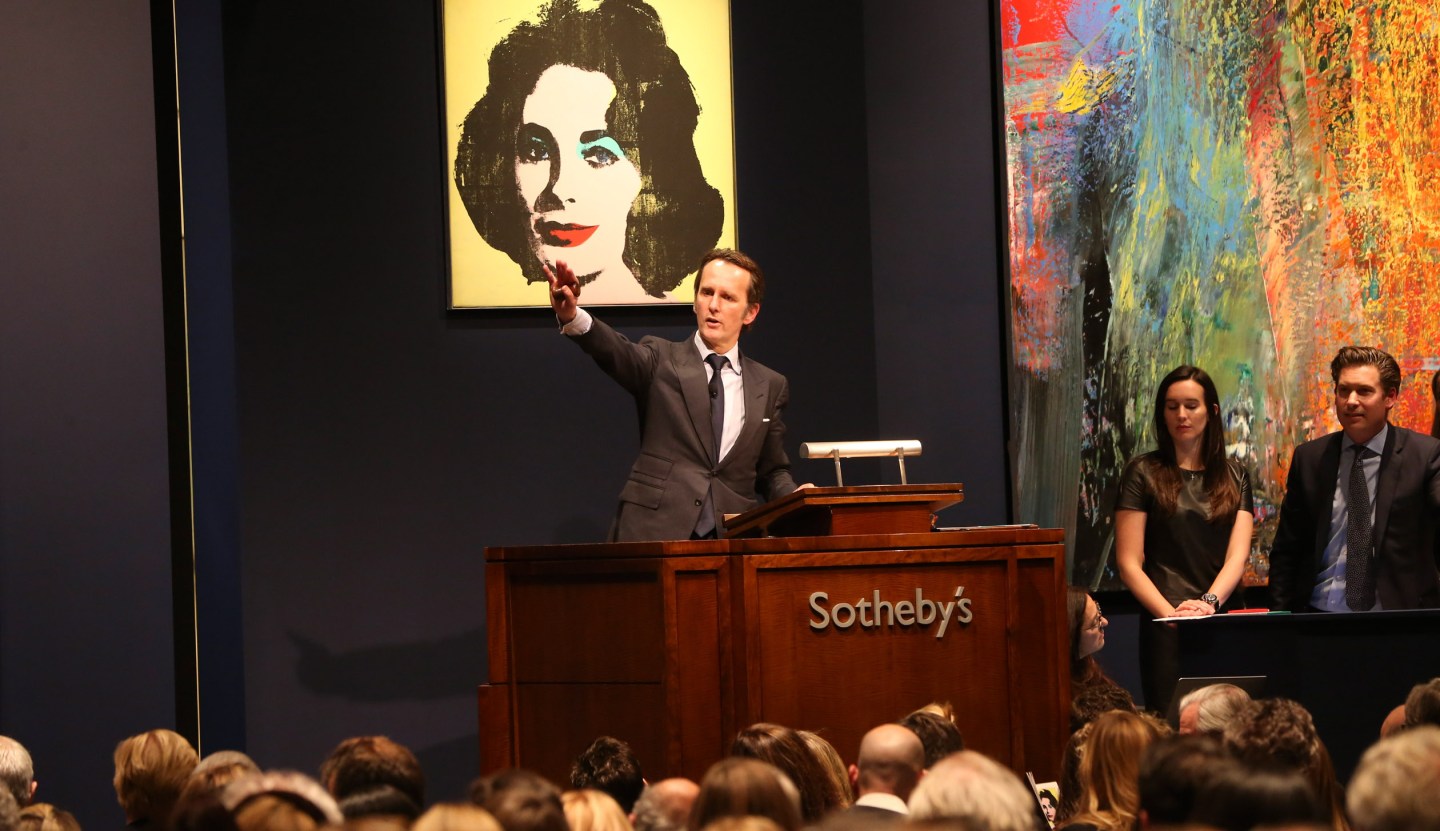 "Liz #1 (Early Colored Liz)," an Andy Warhol painting, sells for $20.3 million during a 2013 auction at Sotheby's in New York. As Sotheby's grapples with a seismic shift in the business of selling art, its largest shareholder, Daniel Loeb, has demanded change claiming the auction house has not adapted quickly enough to the changing market.
