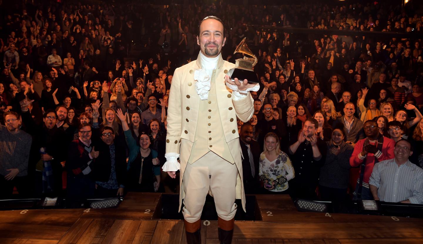Lin-Manuel Miranda celebrates receiving the GRAMMY award for "Hamilton's" Best Musical Theater Album on stage during a February, 2016 performance.