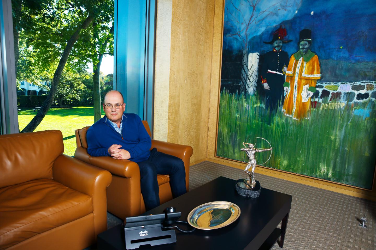 Cohen next to "Gasthof" in his office at the Stamford, Conn., headquarters of Point72.