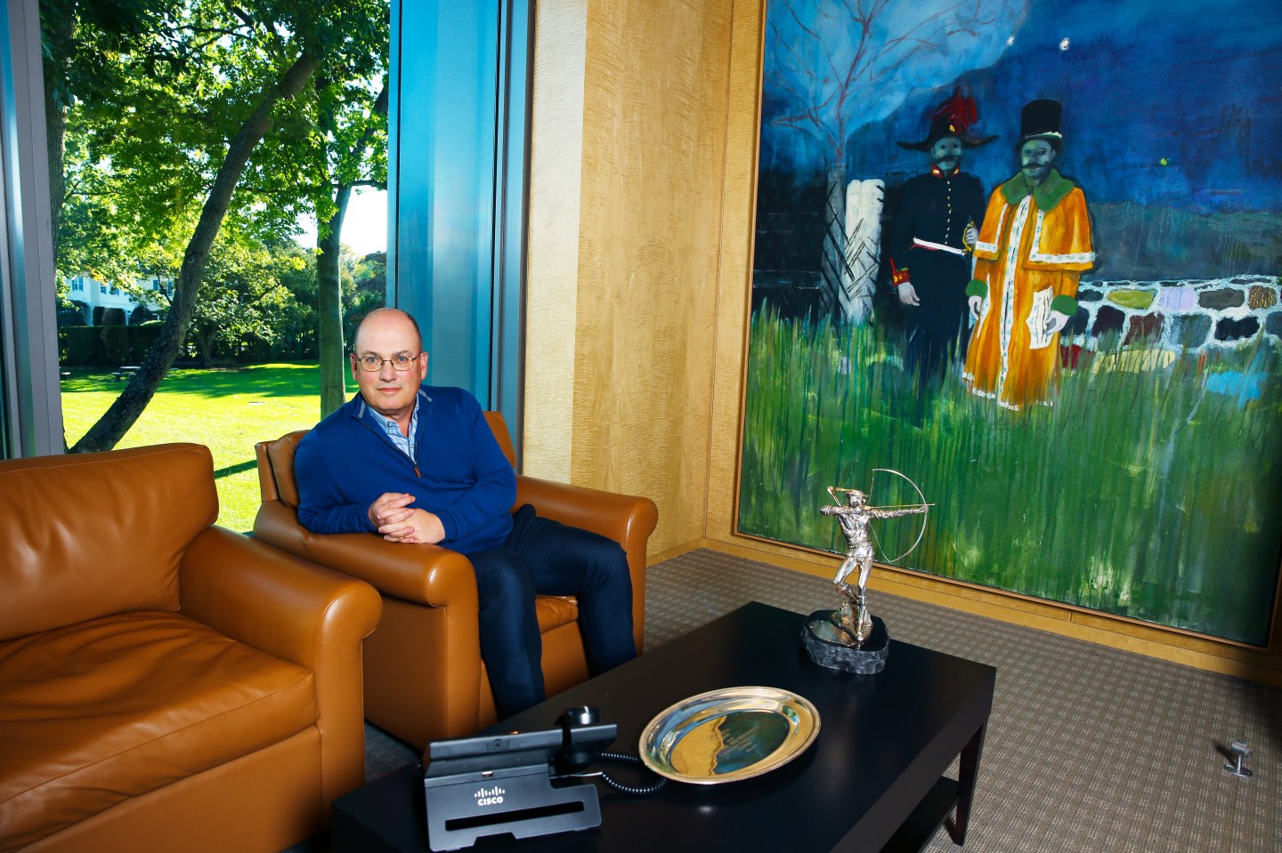 Cohen next to "Gasthof" in his office at the Stamford, Conn., headquarters of Point72.