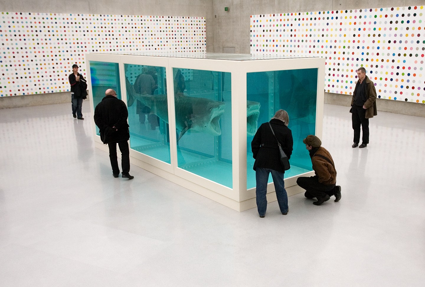 Visitors contemplate a work by British artist Hirst at the Kunsthaus in Bregenz